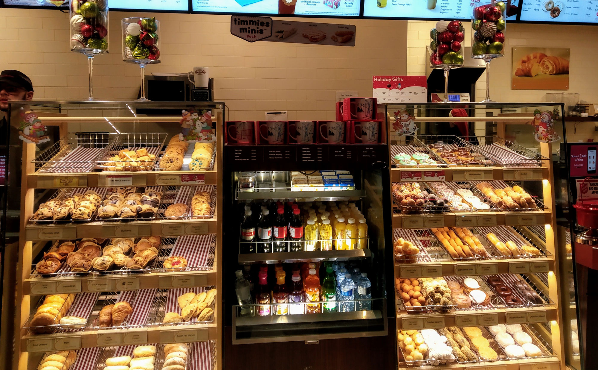 A display of pastries and drinks in a Tim Hortons store.